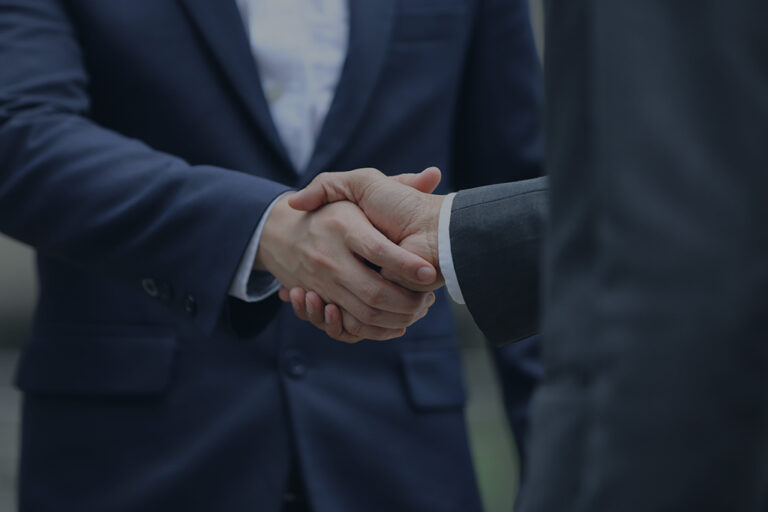 Business people shaking hands after successful negotiations